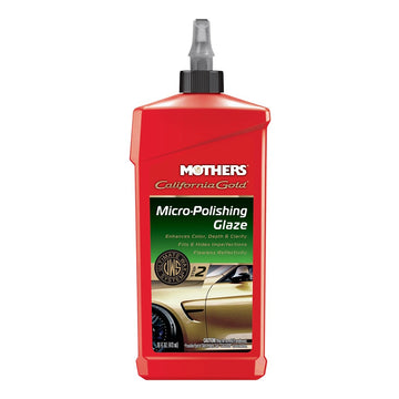 A red bottle of Mothers California Gold Micro-Polishing Glaze with a close up of a gold car on the label. On a white background.
