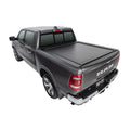 Gray Ram truck with a tonneau cover on a white background
