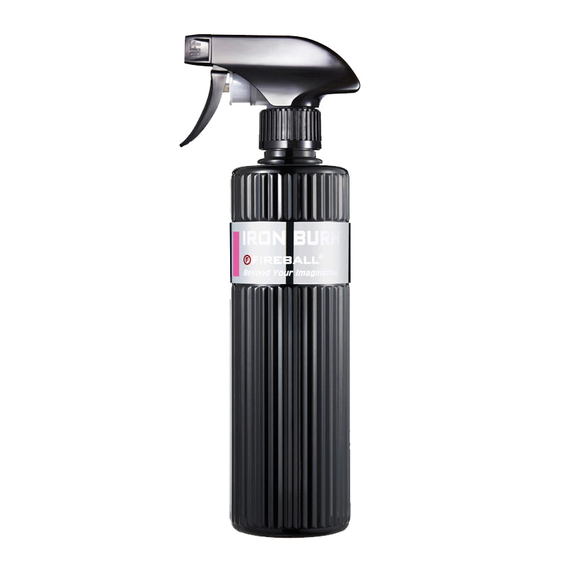 Black spray bottle with a white label on a white background